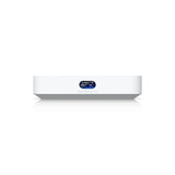 Dispositivo de red Ubiquiti con pantalla iluminada mostrando tráfico en tiempo real sobre chasis blanco minimalista
