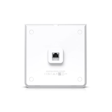 Parte trasera del access point Ubiquiti blanco con puerto PoE IN+ central y círculos de montaje en esquinas