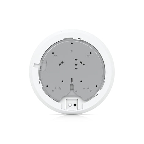 Placa de montaje interna blanca con carcasa gris circular y puertos de conexión