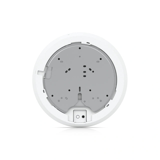 Placa de montaje interna blanca con carcasa gris circular y puertos de conexión