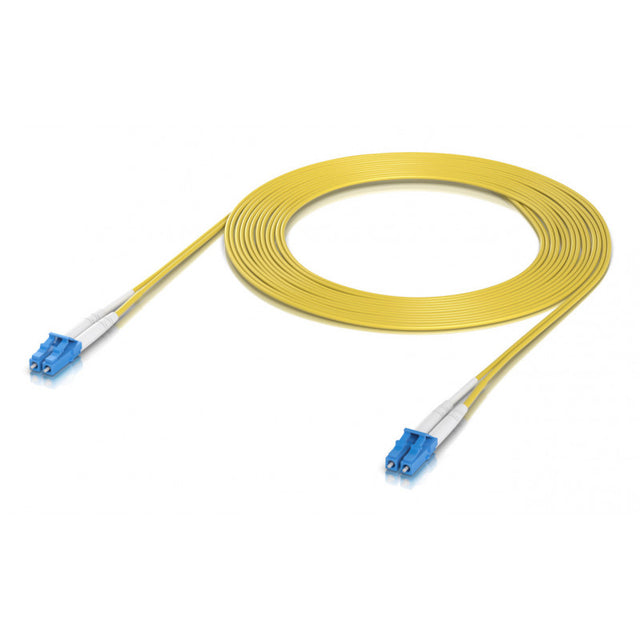 Cable patch cord fibra óptica OS2 amarillo enrollado con conectores LC azules sobre fondo blanco